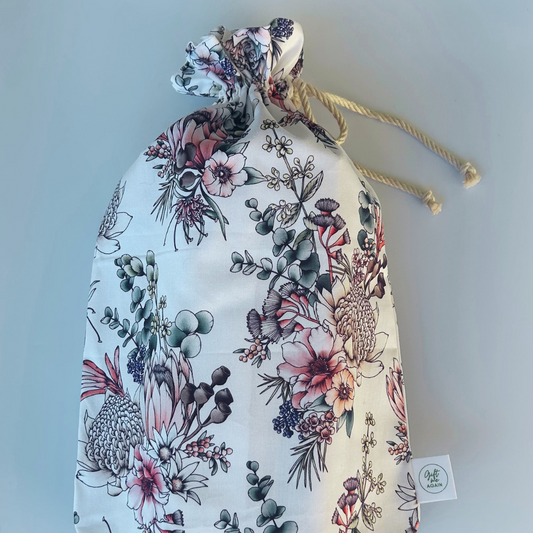 Floral drawstring bag on a light gray background