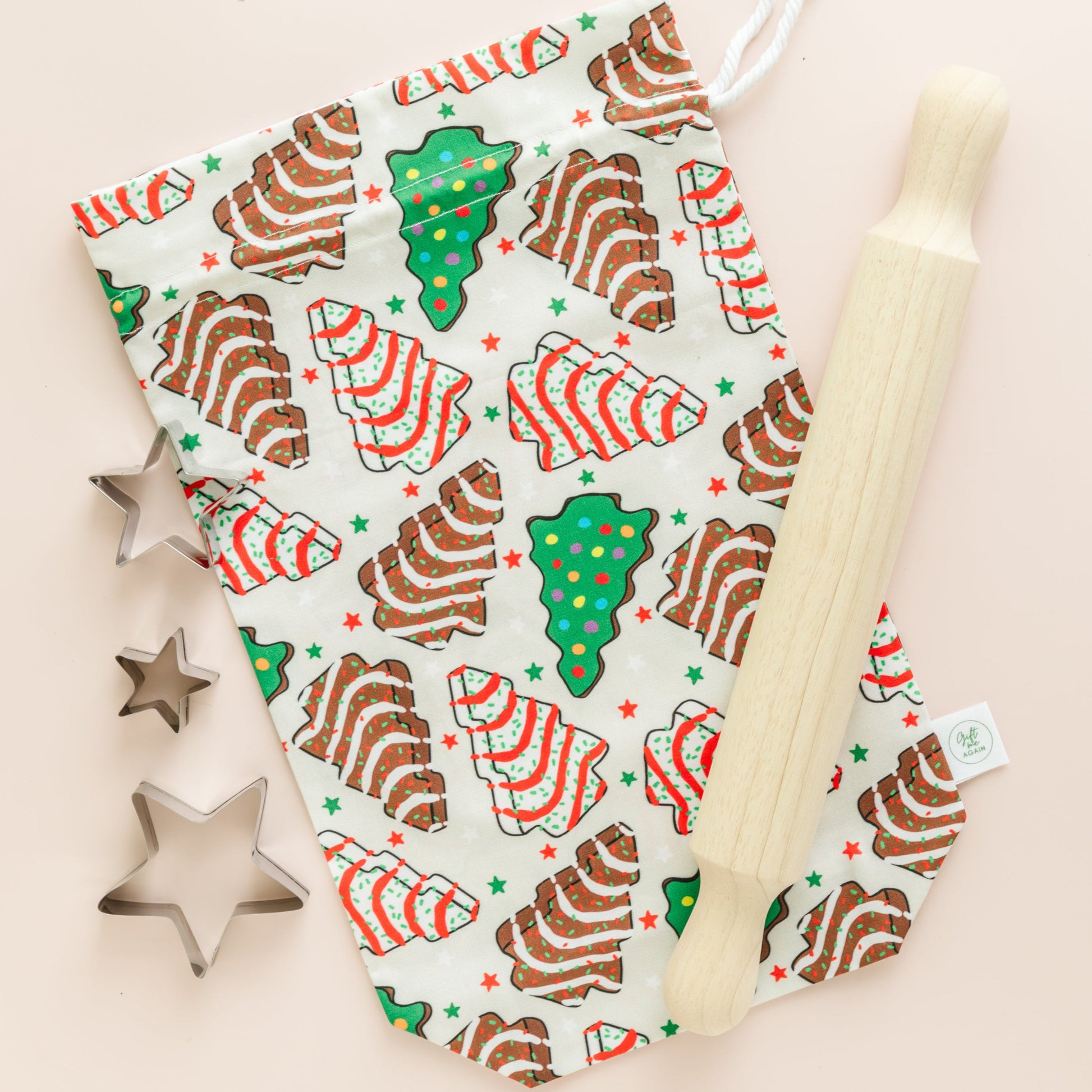 Fabric with Christmas-themed pattern cookie on a beige background